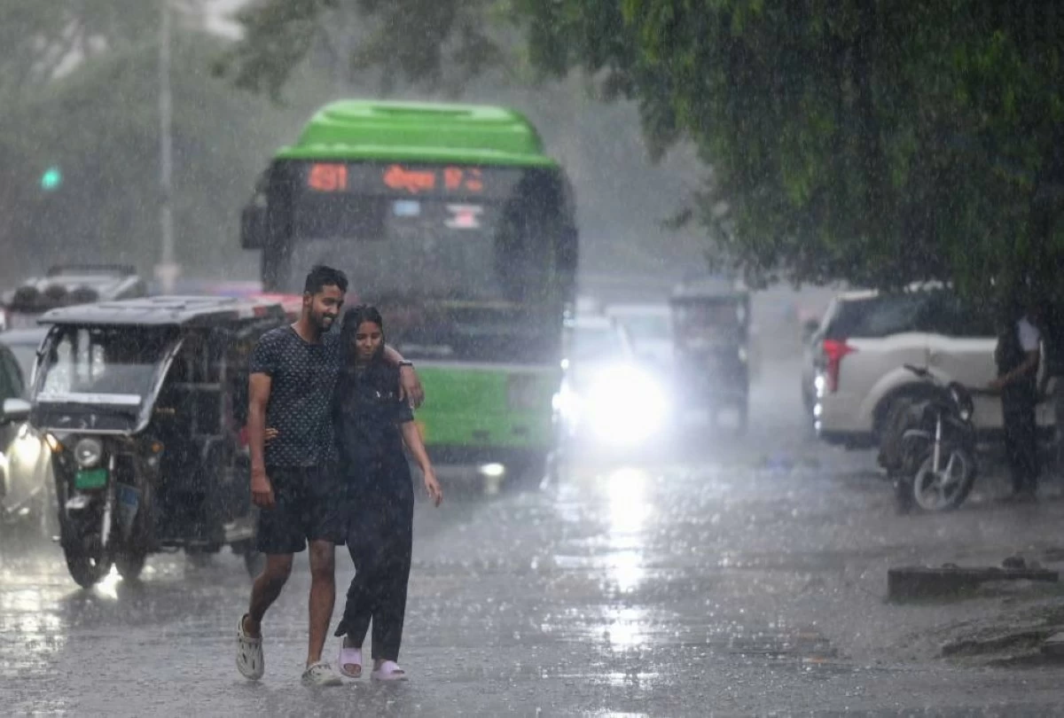  Commuters seen on sector 19 road during evening rain, on June 29, 2025 in Noida, India. Parts of the national capital received rainfall, prompting the India Meteorological Department (IMD) to issue an 'orange' alert and forecast light to moderate showers across the city. (Photo by Sunil Ghosh/Hindustan Times via Getty Images)