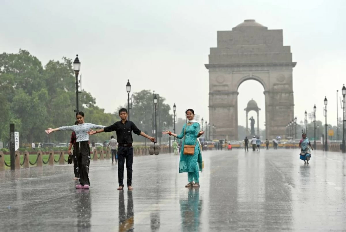 The alert had warned of light to moderate rainfall at several locations across Delhi-NCR. The downpour not only brought respite from the heat but also signaled the gradual advance of the Southwest Monsoon across northern and central India. (Photo by Sanjeev Verma/Hindustan Times via Getty Images)