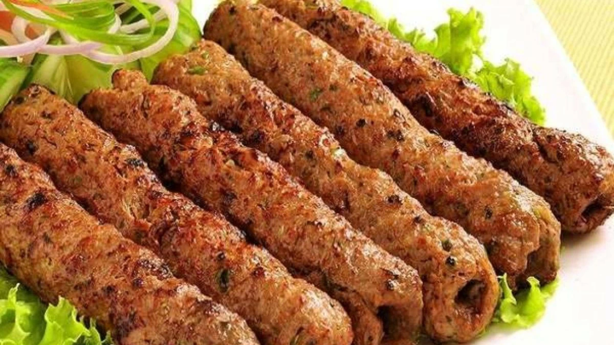 Seekh Kebab: A popular dish from North India, it is grilled over charcoal for a smoky flavour and served with mint sauce and onions for a flavourful pairing. (Photo credit: Pinterest)