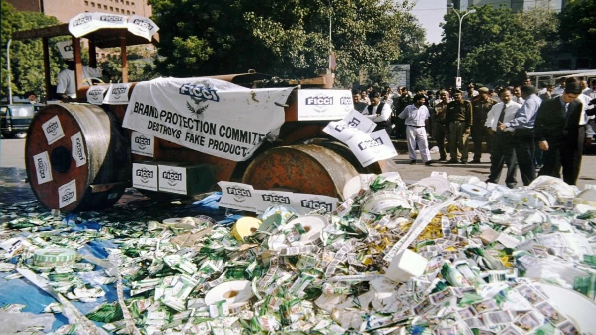 A road roller crushes fake products during a campaign against counterfeits organised by Federation of Indian Chamber of Commerce and Indistry (FICCI) in New Delhi. (Photo Credit: Sondeep Shankar/Getty Images)