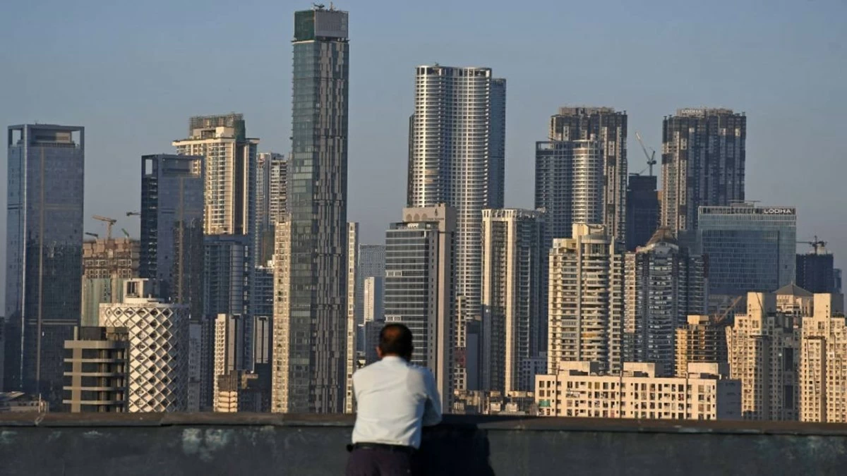 A man looks towards high rise buildings in Mumbai. The land in metro cities like Mumbai, Delhi, Chennai, Pune and Bengaluru is limited and prices of real estate are zooming, as a result of which new hotel developments have become extremely costly.(Photo Credit: Ashish Vaishnav/SOPA Images/LightRocket via Getty Images)