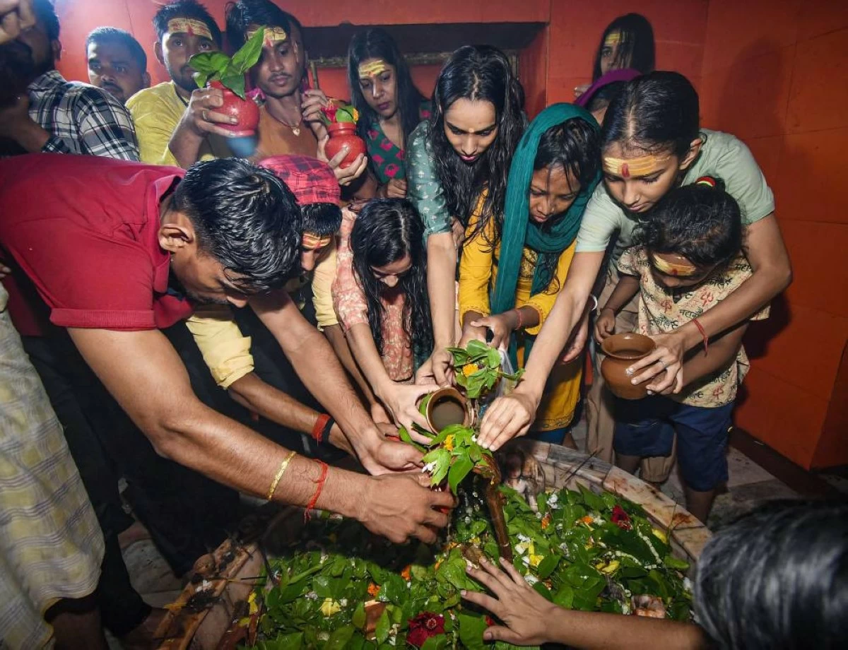 People offer prayers to Lord Shiva in the holy month of 'shravan' at a temple, in Patna, Bihar
