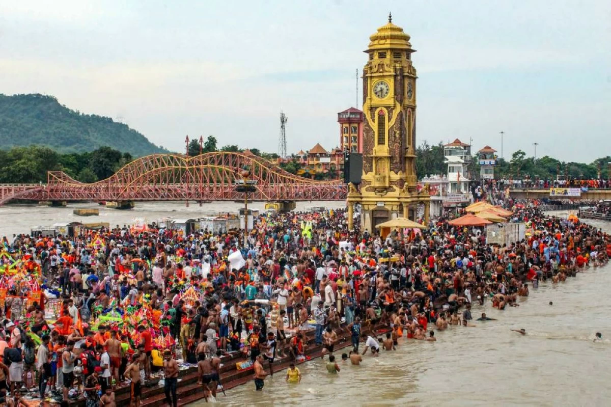 ‘Kanwariyas’ and others take a holy dip in the River Ganga river on Monday at Har Ki Pauri in Haridwar