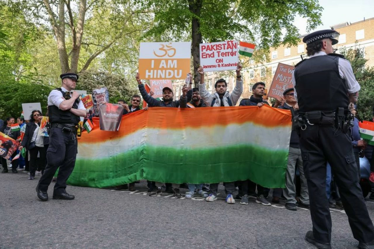 Members of the Indian community hold a large flag of India as Indians and Pakistani protest outside Pakistan Embassy in London, following Pahalgam terror attack on 22 April 2025, which claimed at least 26 lives. 
(Photo Credit:  Steve Taylor/SOPA Images/LightRocket via Getty Images)