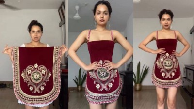 Woman designs stunning dress from sofa covers.