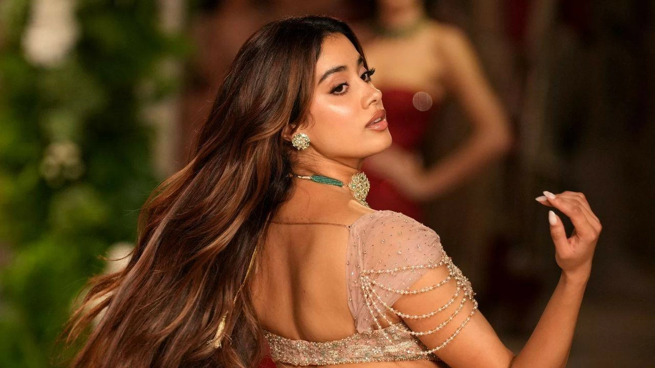 Her statement blouse had beaded shoulder drapes, adding a bold twist to the otherwise delicate ensemble.
