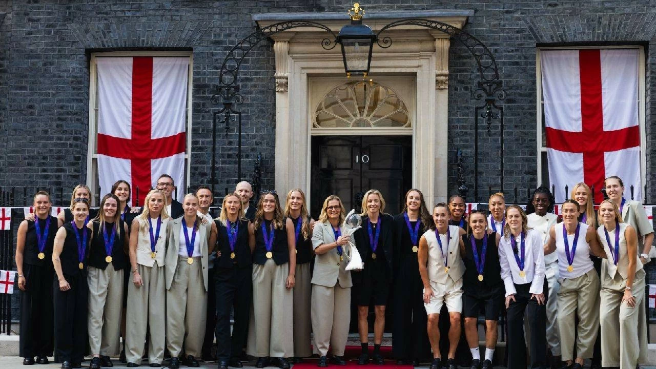 The England squad wearing their winners' medals arrive in Downing Street for a reception at No 10, hosted by Deputy Prime Minister Angela Rayner, in celebration of England's victory over Spain on July 28, 2025 in London, England. England defeated Spain in the UEFA Women's EURO 2025 Final to retain the trophy on 27 July.