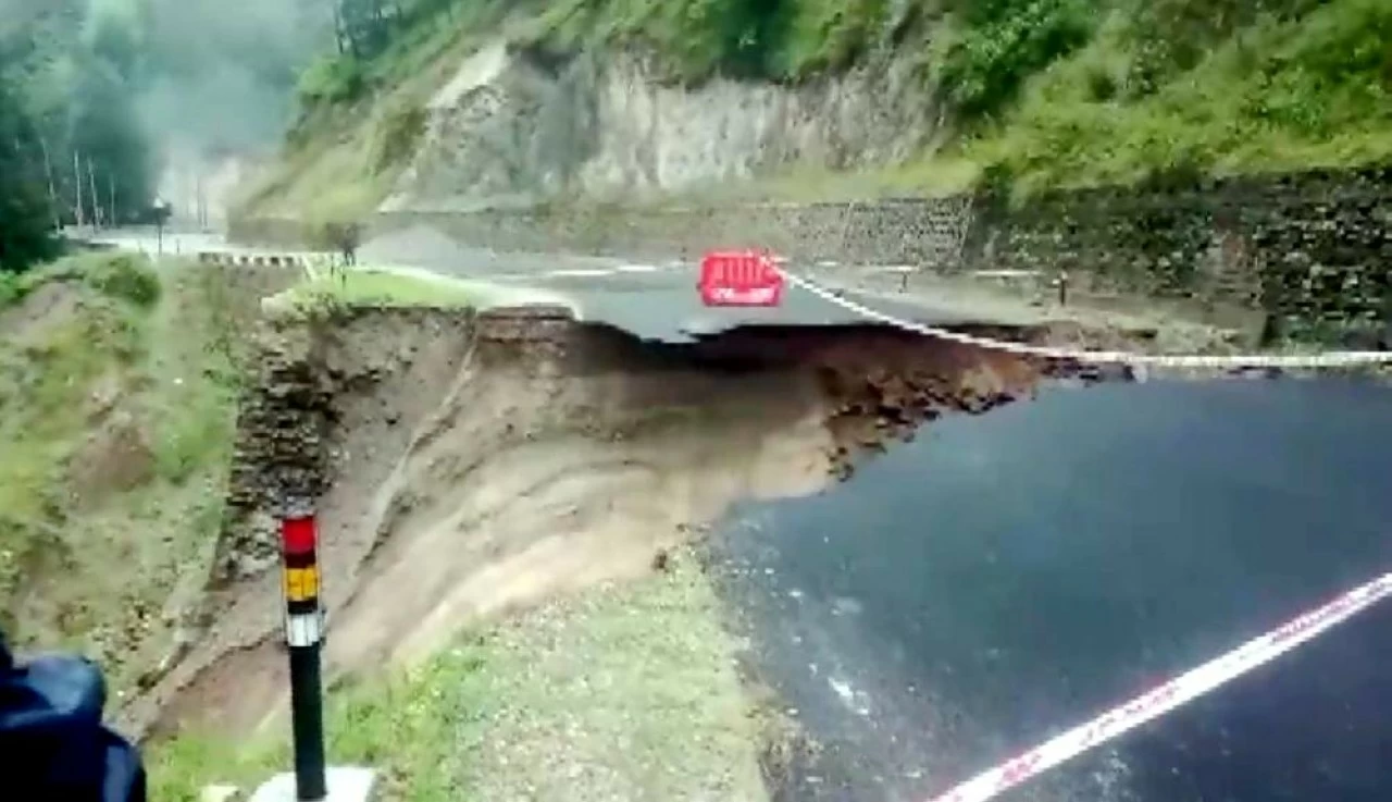 A damaged road after heavy rainfall, near Raini village in Chamoli district