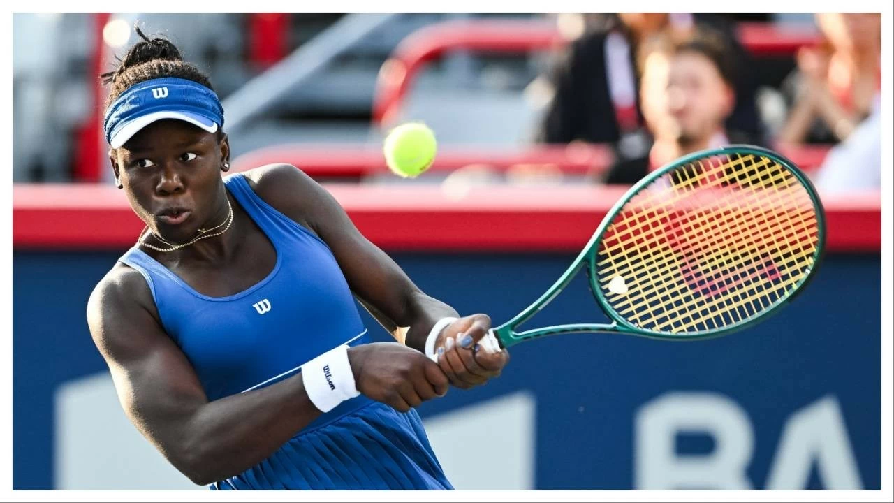 Victoria Mboko returns the ball to Elena Rybakina in semifinal play at IGA Stadium.