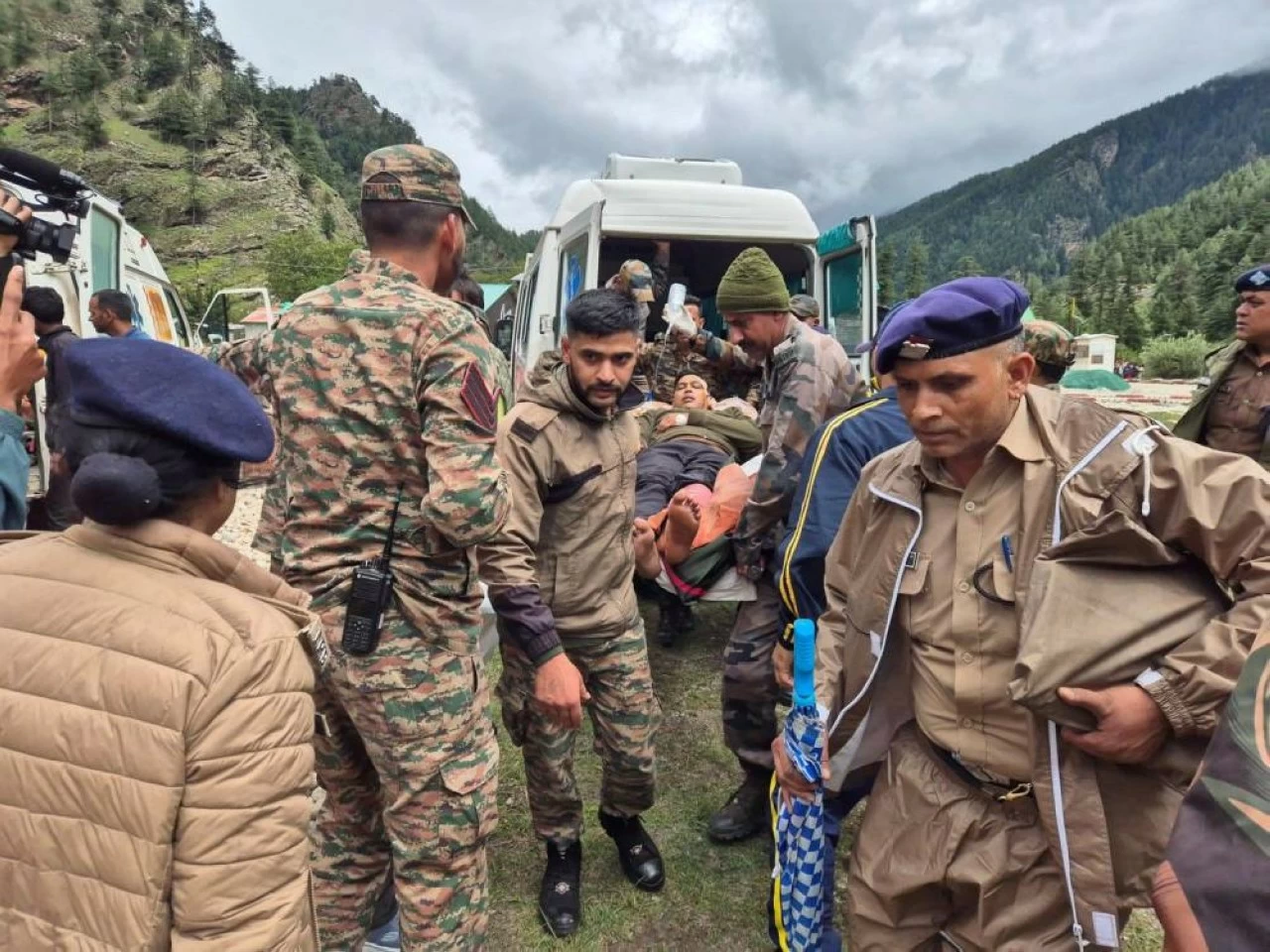 Emergency teams rush a rescued pilgrim to an ambulance. At least five lives were lost and over 50 are still reported missing in the disaster.