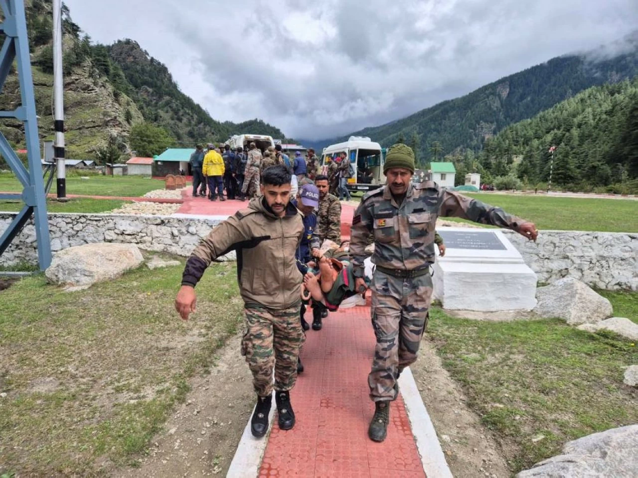 Army personnel carry an injured pilgrim during the Uttarkashi rescue mission. Over 300 pilgrims were evacuated from Gangotri to Mukhwa amidst landslides and flash floods on Thursday.