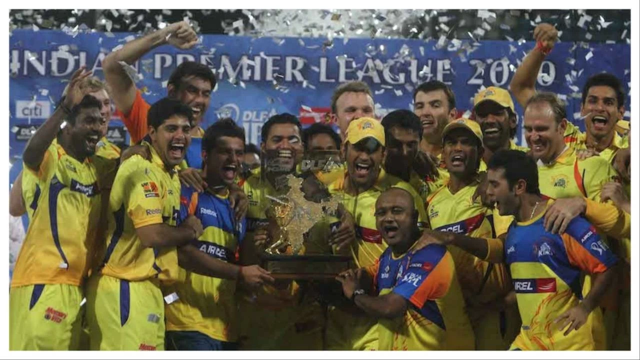 CSK players celebrate with the IPL 2010 trophy.