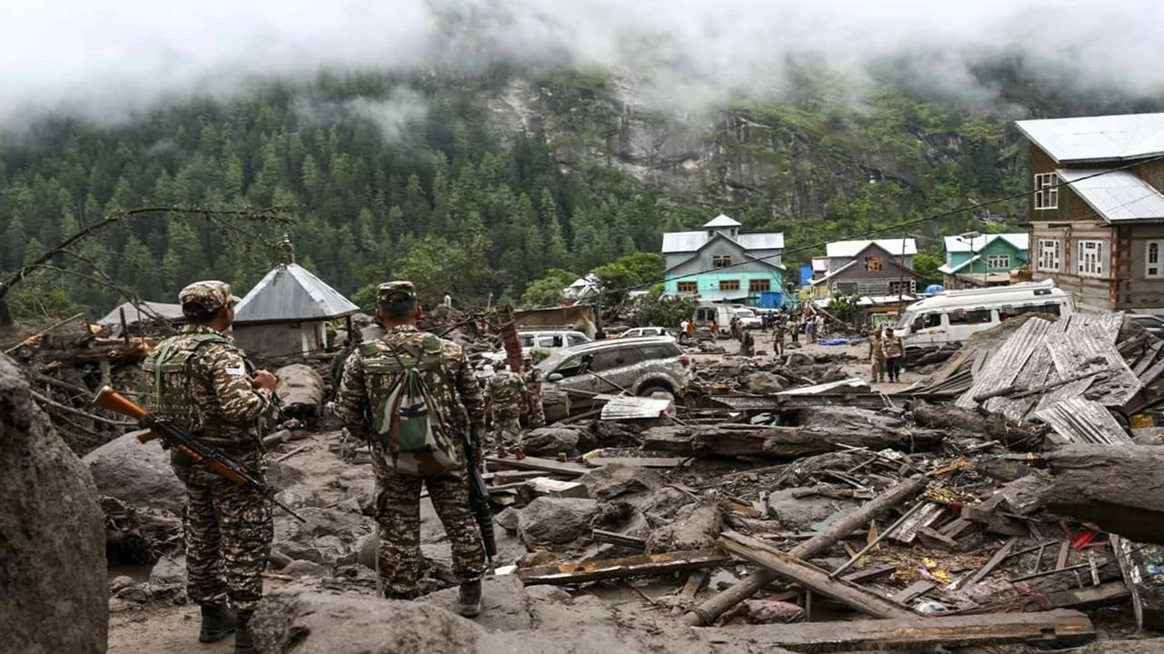Security personnel stand amid the debris at an affected area following a cloudburst in Kishtwar district, Jammu and Kashmir, on Friday, Aug. 15, 2025. At least 60 people were killed and over 100 suffered injuries in the incident, according to officials.