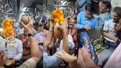 Passengers celebrate Janmashtami with Dahi Handi in Mumbai local.