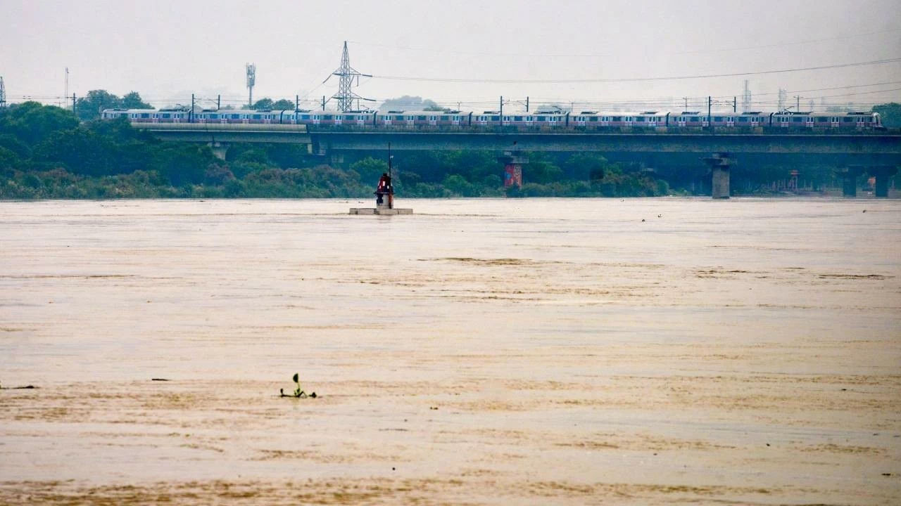 The Yamuna in Delhi flowing above the warning level at the Old Railway Bridge for the second day on Monday. (PTI Photo)
