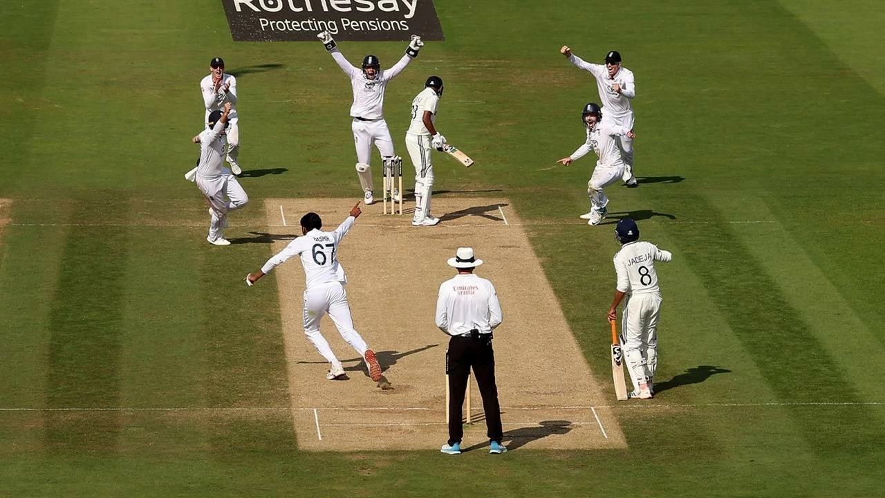 Shoaib Bashir of England celebrates taking the wicket of Mohammed Siraj. 