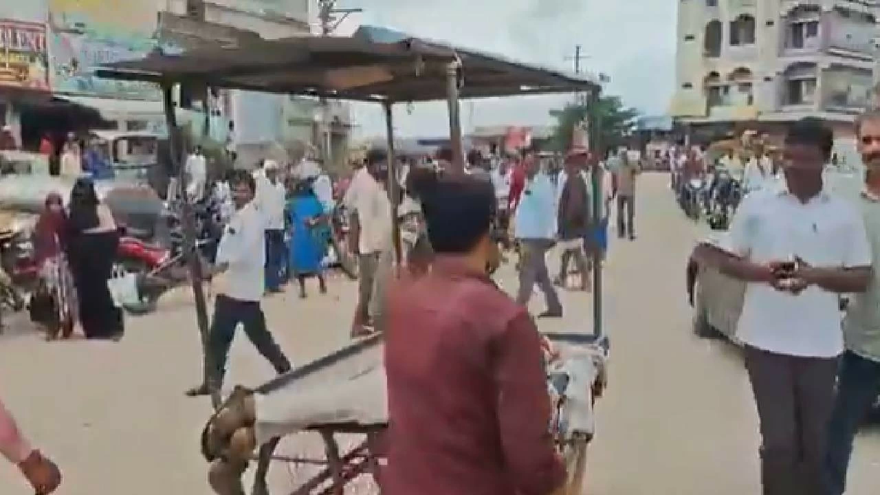 Police shift Mogulayya's body on a push cart.