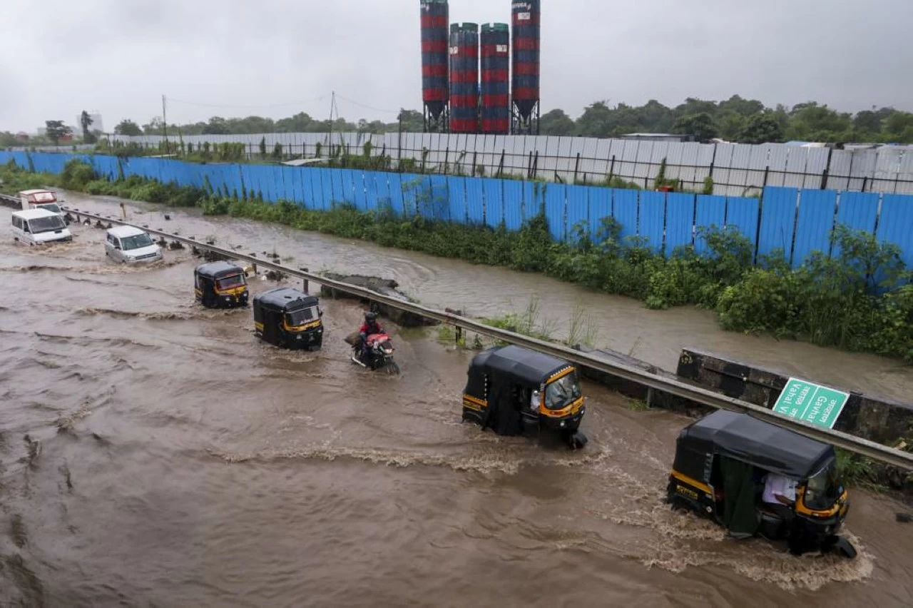 Flooded roads near Navi Mumbai International Airport on Monday bring traffic to a standstill. (PTI)