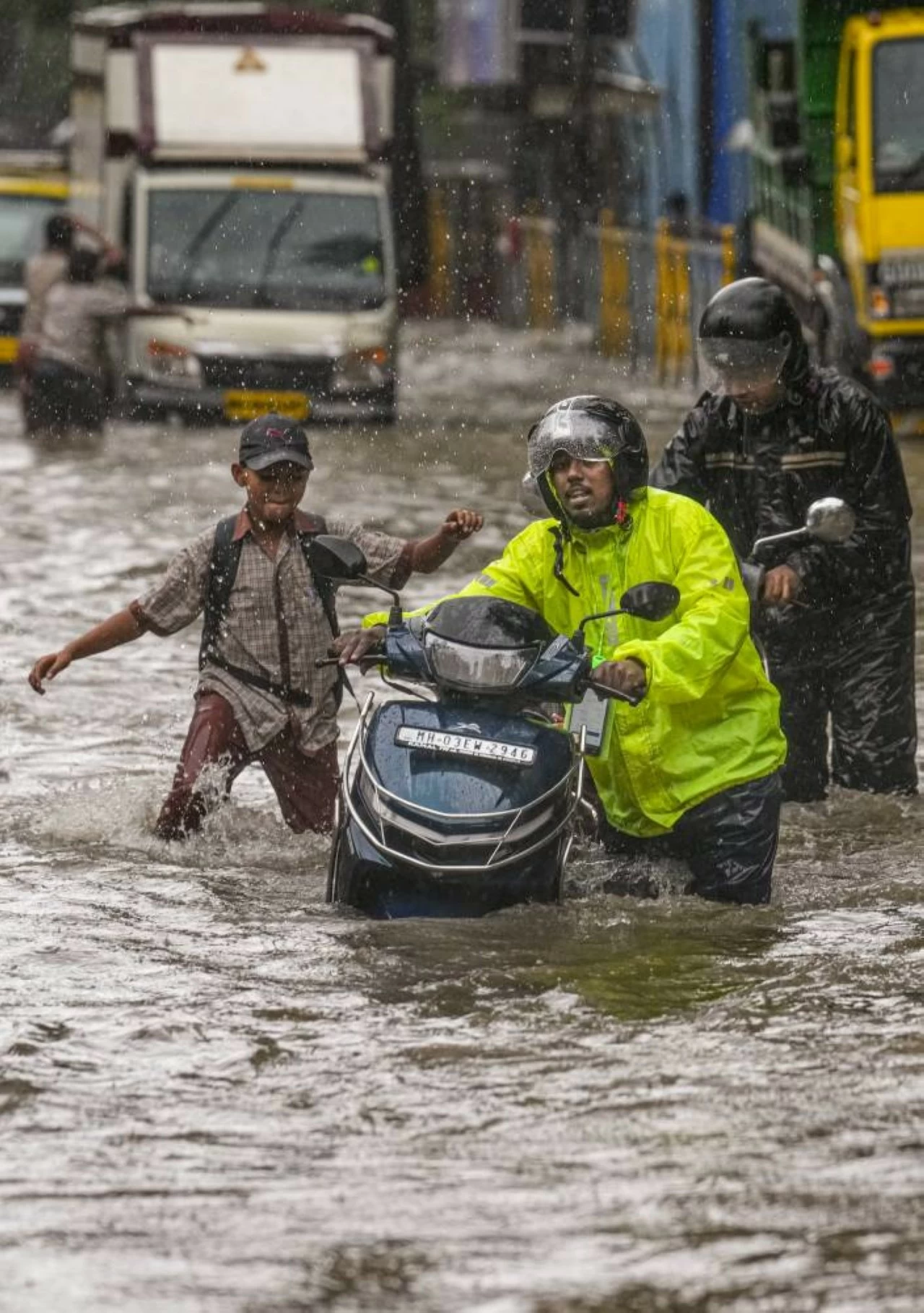 A motorist tried to wade through heavy waterlogged street in at Kurla in Mumbai. (PTI)