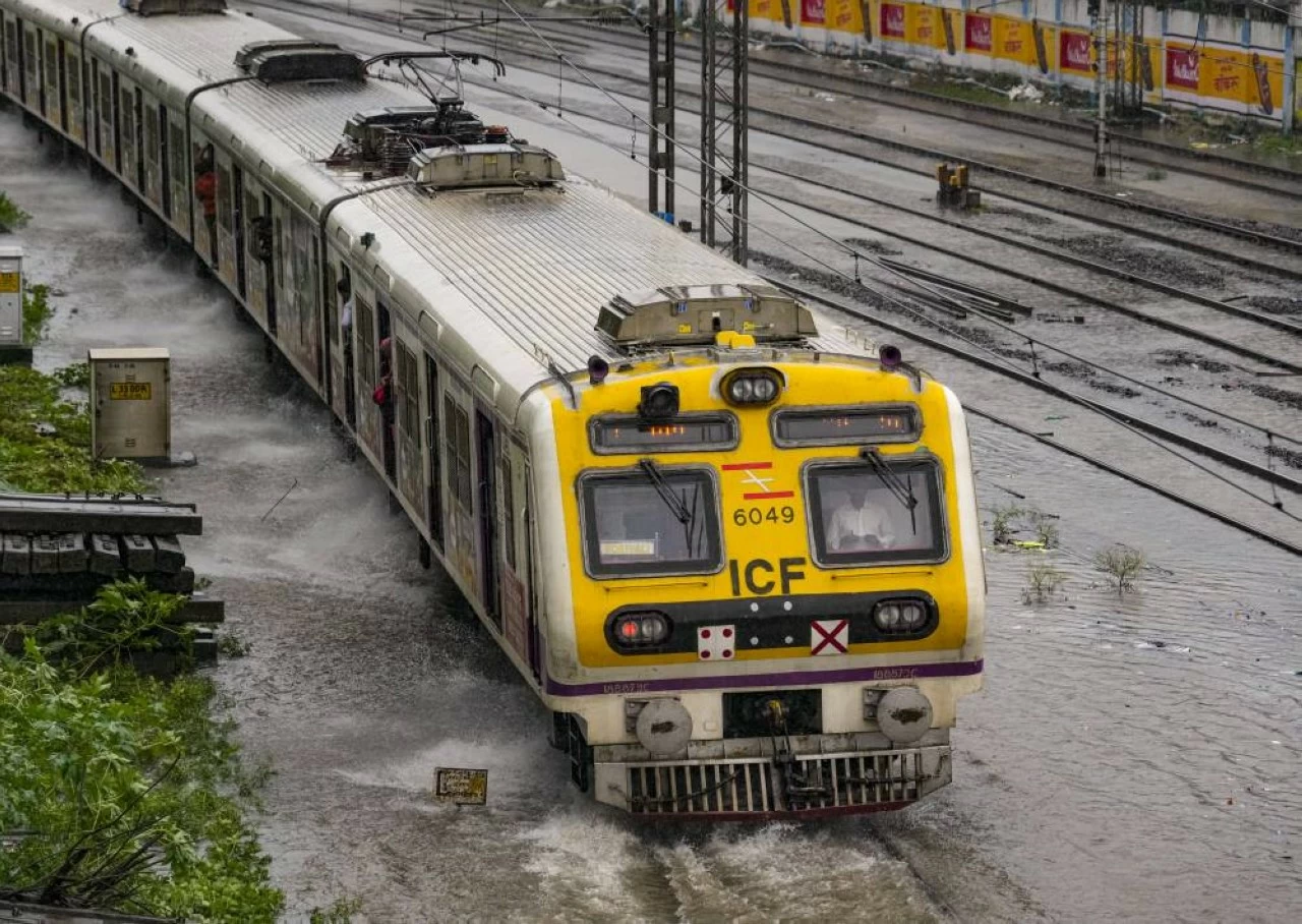 Local services get delayed in Mumbai due to submerged railway tracks in Mumbai due to heavy downpour for past couple of days. (PTI)