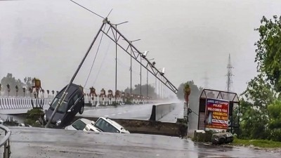 Vehicles stuck as a portion of the Fourth Tawi Bridge gets damaged after relentless rainfall, at Bhagwati Nagar, in Jammu, on Tuesday, Aug. 26, 2025. (PTI)
