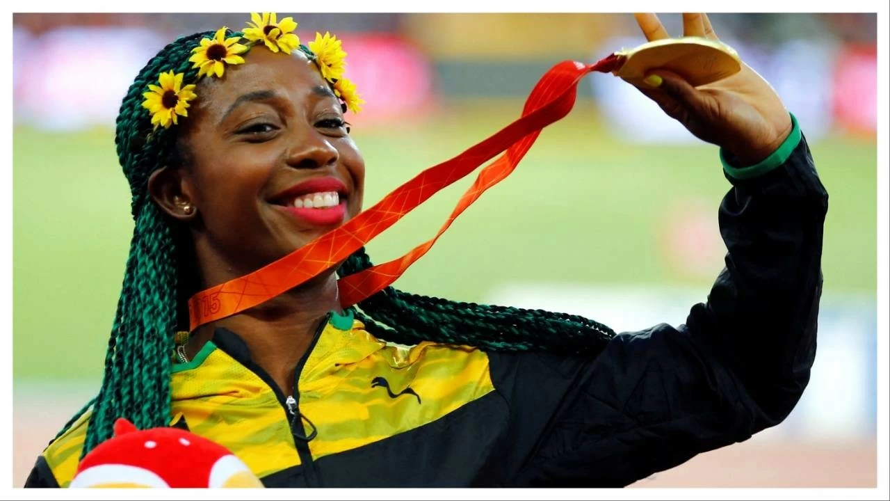 Shelly-Ann Fraser-Pryce presents her gold medal after the women's 100m event at the 15th IAAF World Championships in Beijing on August 25, 2015.