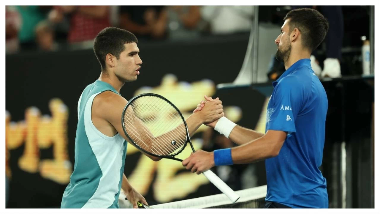 Novak Djokovic embraces Carlos Alcaraz following victory in the Australian Open quarter-finals on January 21 in Melbourne.