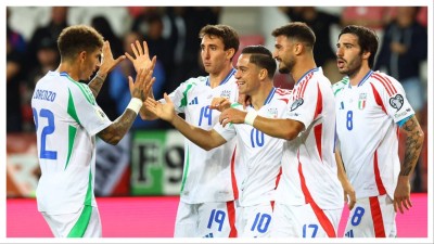 Italy players celebrate scoring against Israel.