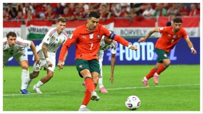 Portugal&#039;s Cristiano Ronaldo scores from the penalty spot.
