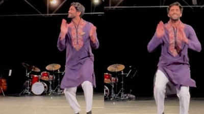 Man tap-dances to Bollywood song.