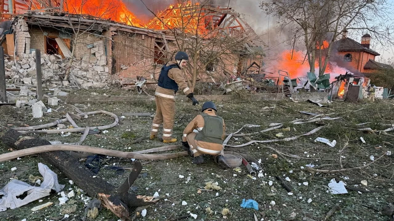 Firefighters work at the site of a residential area hit during Russian drone and missile strikes. (Photo credit: Reuters)