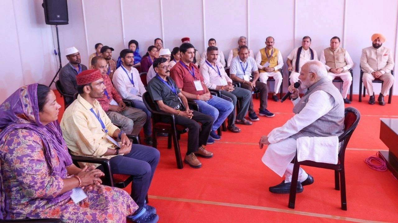 PM Modi interacting with victims of the floods and landslides in Uttarakhand.
