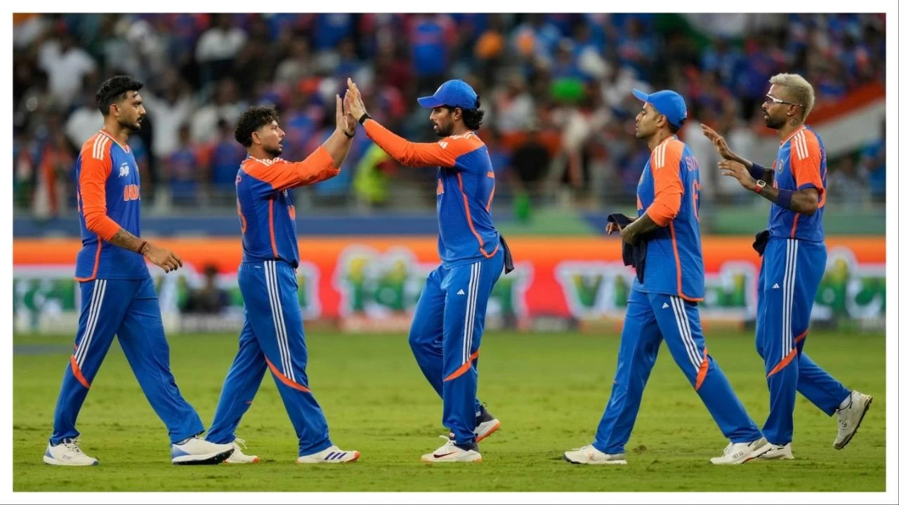 Kuldeep Yadav, second left, and his India teammates celebrate  in Dubai on Sunday.