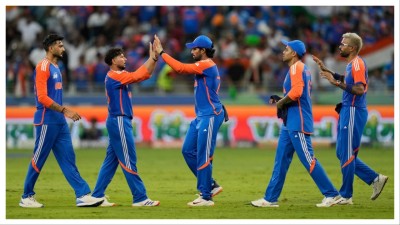 Kuldeep Yadav, second left, and his India teammates celebrate  in Dubai on Sunday.