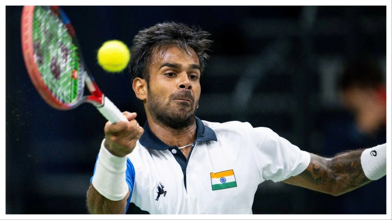 Sumit Nagal hits a return against Switzerland's Marc- Andrea Huesler in a Davis Cup match on September 12.