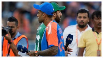 Pakistan&#039;s captain Salman Agha, rear, walks past India&#039;s captain Suryakumar Yadav in Dubai on Sept. 14.