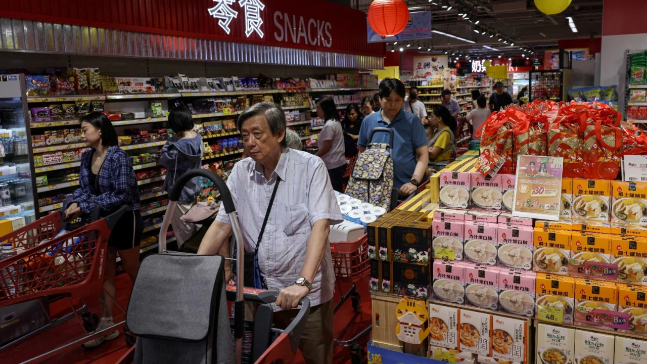 Residents stock up on supplies at a supermarket to prepare for the approaching Typhoon Ragasa, in Hong Kong