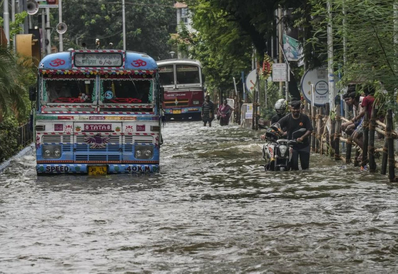 Bus wades through waterlogged road in Kolkata