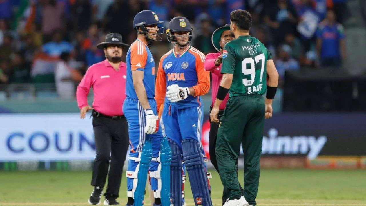 
Shubman Gill of India (L), Abhishek Sharma of India (C) and Haris Rauf of Pakistan (R) during the match between India and Pakistan at Dubai International Stadium on September 21, 2025 in Dubai, United Arab Emirates.