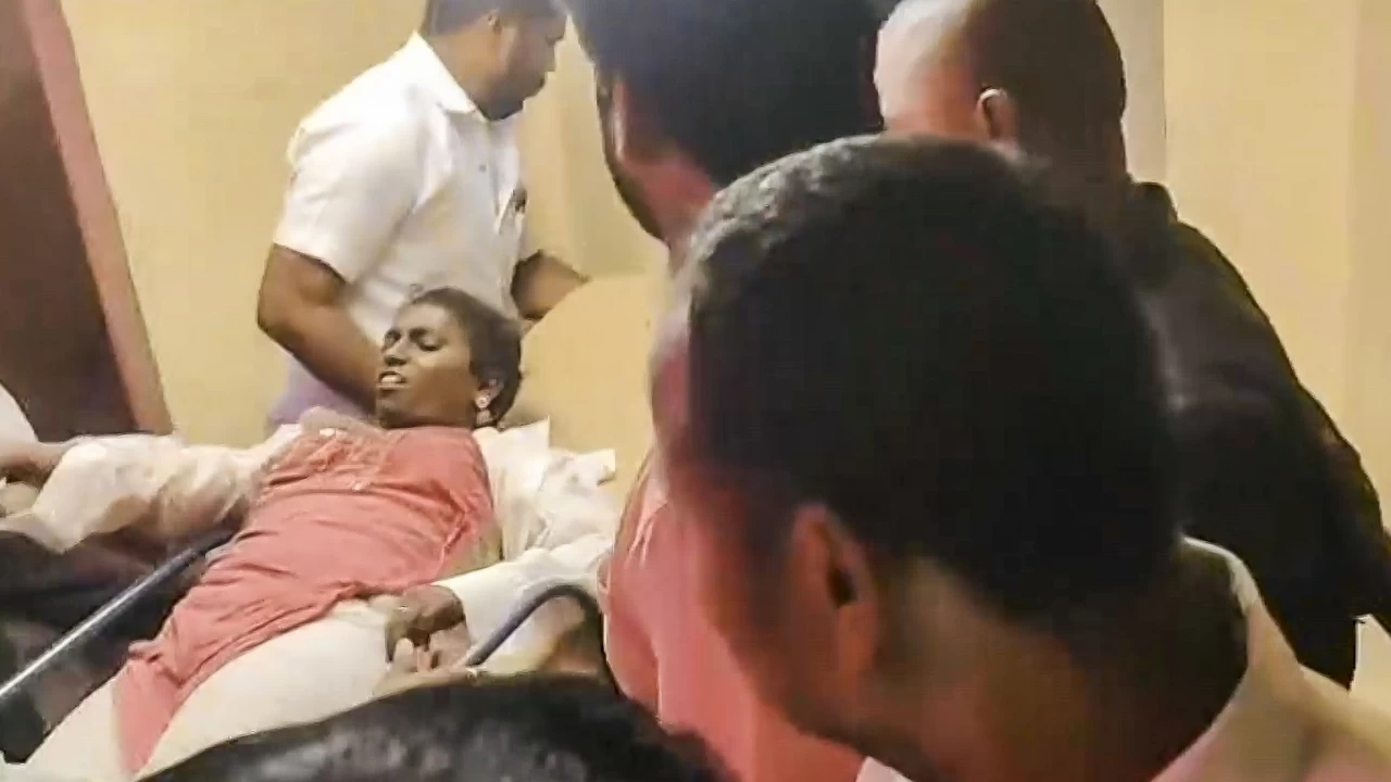 An injured woman undergoes treatment at a hospital after a stampede occurred at TVK chief and actor Vijay's rally