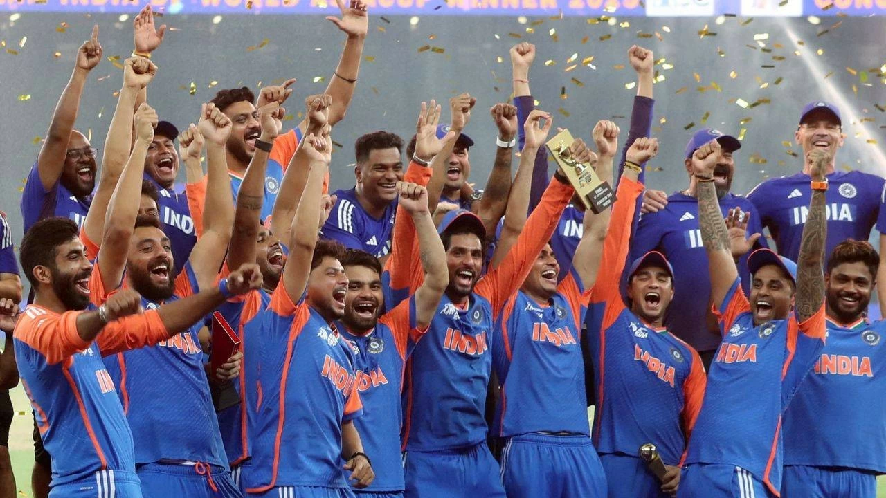 Suryakumar Yadav celebrating with his teammates after winning the Asia Cup during the trophy presentation.