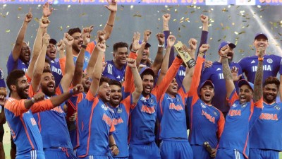 Suryakumar Yadav celebrating with his teammates after winning the Asia Cup during the trophy presentation.