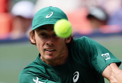 Australia's Alex de Minaur in action during his round of 64 match against Argentina's Camilo Ugo Carabelli.