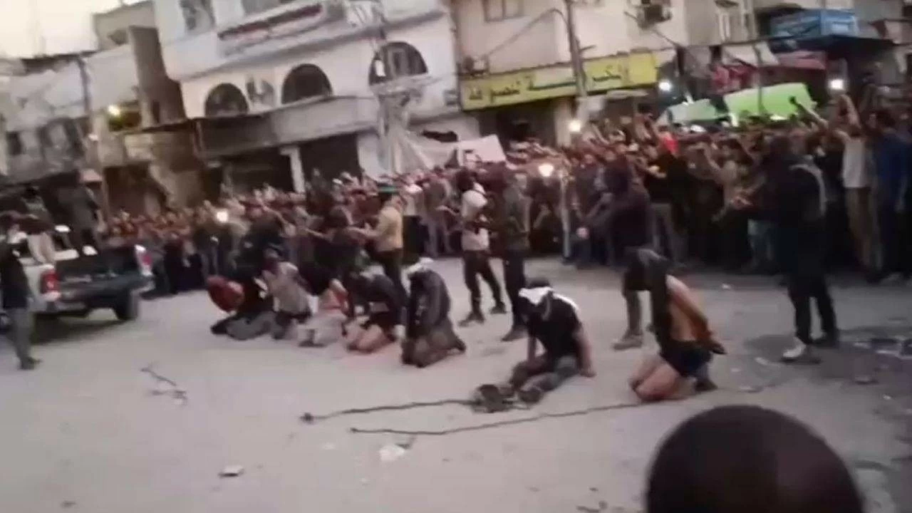 Disturbing footage circulating online shows Hamas gunmen executing seven men in a Gaza City square. 