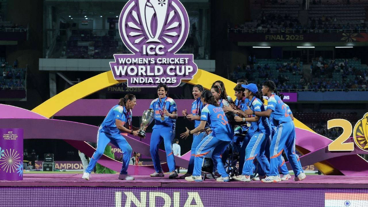 Indian women&#039;s team celebrating with the World Cup trophy