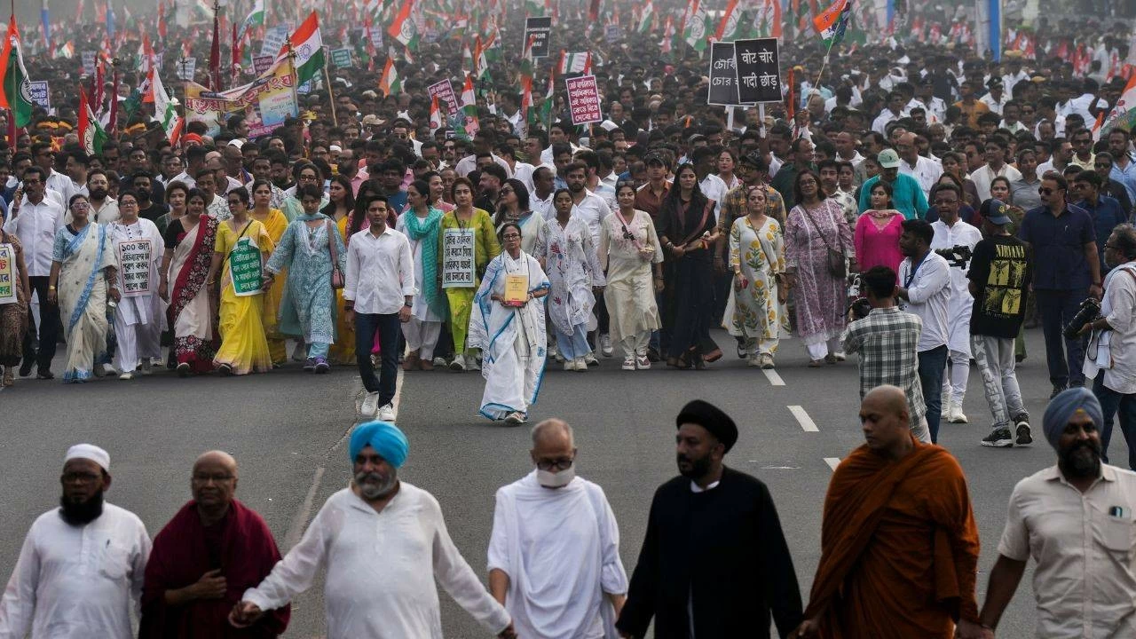 Mamata Banerjee and Abhishek Banerjee and other party leaders takes part in a protest rally against SIR in Kolkata on Tuesday