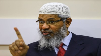 Naik continued to remain wanted in India by on charges of encouraging communal hatred and delivering controversial sermons. (Salih Zeki Fazlioglu/Anadolu Agency/Getty Images)
