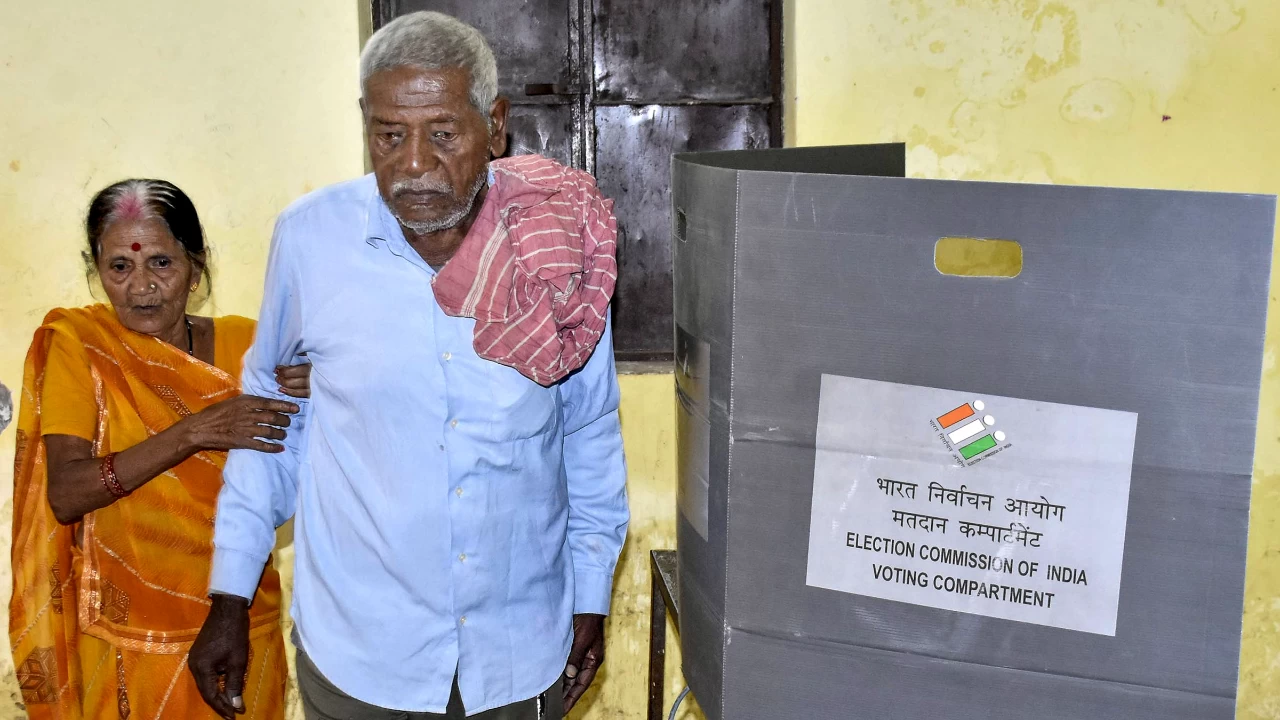 Elderly voters leave after casting votes at a polling station during the first phase of the Bihar Assembly elections, in Patna. This phase saw enthusiastic participation from voters. (Photo credit: PTI)