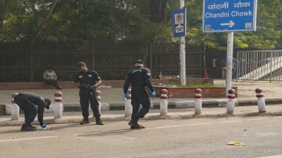 NSG personnel collect samples from the site of an explosion near the Red Fort in New Delhi on Tuesday (PTI Photo)