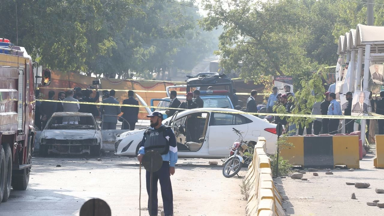 Security forces take measures at the scene where at least 12 people were killed and several others injured in an explosion outside a court complex in Pakistan&#039;s capital, Islamabad, on November 11, 2025.